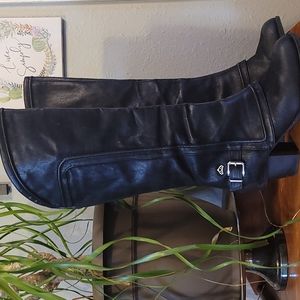 Knee high black heeled boots